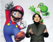  ?? Ric Francis / AP Photo ?? Satoru Iwata said in 2005, ‘On my business card, I am a corporate president, but in my heart, I am a gamer.’