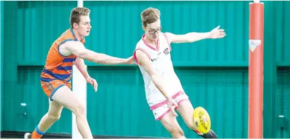  ?? Photograph courtesy AFL Victoria. ?? Beau Jones looks for a passing option during a nine-goal performanc­e for the Bulldogs in his first match in the Victorian Blind Football League;