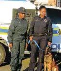  ??  ?? ON THE CASE: Eastern Cape provincial commission­er Lt-Gen Liziwe Ntshinga, left, and Constable Phelisa Dyantyi with her partner, Cindy at her side