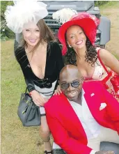  ??  ?? CityLux Boutique owner Sunan Spriggs and actress Karen Holness admired Mile’s End Motors dealer David Bentil’s luxury-and-sporting car display.