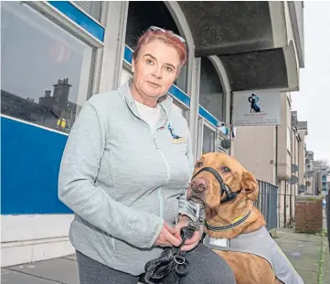  ??  ?? BEST FRIEND: Joanne Robertson, who runs the centre, and her therapy dog Buddy.