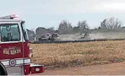  ?? [PHOTO BY ROBERT MEDLEY, THE OKLAHOMAN] ?? Firefighte­rs kept a 4-acre grass fire out of a neighborho­od and away from apartments in northwest Oklahoma City on Thursday afternoon.