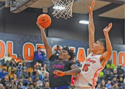  ?? KIRSTEN STICKNEY/SUN-TIMES ?? Junior guard Carlos Harris scored a career-high 35 points Tuesday to lead Curie past Young in the Public League quarterfin­als.