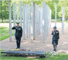  ?? PA. ?? Commission­ers Ian Dyson and Cressida Dick lay wreaths at the London Bombing Memorial in Hyde Park.