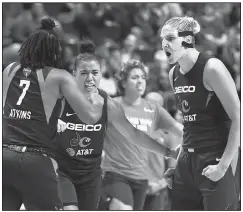  ?? AP/JESSICA HILL ?? Washington’s Elena Delle Donne (right) celebrates a play with Ariel Atkins (left) and Natasha Cloud on Tuesday during the second half of Game 4 of the WNBA Finals against the Connecticu­t Sun in Uncasville, Conn.