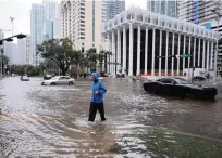  ?? CARL JUSTE cjuste@miamiheral­d.com ?? A view of the deluged Southwest 13th Street and Brickell Avenue intersecti­on in Miami on Nov. 9, after heavy rains from Tropical Storm Eta — one of two storms this year that hit South Florida hard.