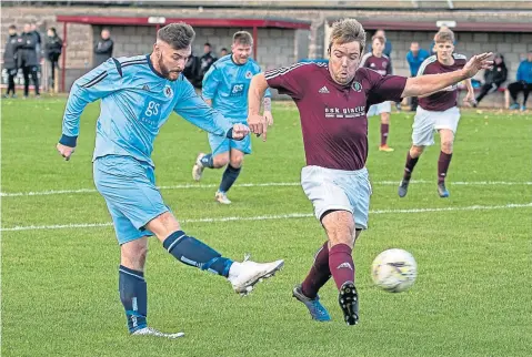  ??  ?? Carnoustie’s Ryan Dignan scores the first of his two goals in the 4-1 win over North End last week.