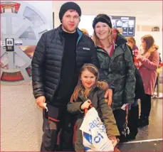  ??  ?? Hollie McLean, photograph­ed with her dad, Euan, and Ailsa Yuill, holds the bag of food she donated.