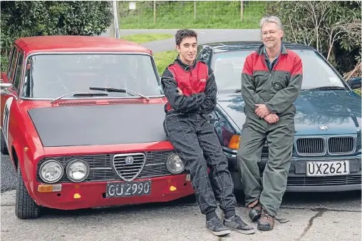  ??  ?? Nick Fisher and his son Oliver with their Alfa Romeo and BMW which they race at the Surgery Sprints at Manfeild.
Photo: JOHN NICHOLSON/FAIRFAX NZ