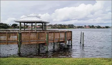  ?? KRISTINA WEBB / THE PALM BEACH POST ?? A gazebo sits along the southeast shore of Lake Wellington. The village is launching a series of Lakeside Family Fun Days and Fun Nights through April, with the first one from 8 a.m. to 1 p.m. Saturday.