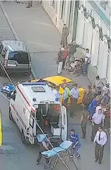  ?? MOSCOW TRAFFIC CONTROL CENTRE PRESS SERVICE VIA AP ?? Ambulance and police respond after a taxi crashed into pedestrian­s on a sidewalk near Red Square in Moscow on Saturday.