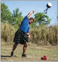  ?? (Democrat-Gazette file photo/Stephen Swofford) ?? Jeffrey Atkinson practices the weight throw in this 2021 photo as he and friends prepare for the Scottish Highland games during the Scottish Festival at Lyon College in Batesville.