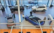  ?? PROVIDED TO CHINA DAILY ?? Customers in a Mercedes-Benz 4S store in Beijing.