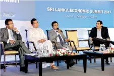  ??  ?? Justice and Buddhasasa­na Minister Wijeyadasa Rajapakse speaks at the Ceylon Chamber of Commerce’s Sri Lanka Economic Summit yesterday in the presence of (from left) National Policies and Economic Affairs Deputy Minister Dr. Harsha de Silva, Developmen­t...