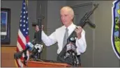  ?? DIGITAL FIRST MEDIA FILE PHOTO ?? Upper Darby Police Superinten­dent Michael Chitwood holds up two long-barrel guns recovered by police during a drug raid in October 2014.