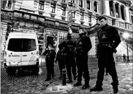  ?? RICCARDO PAREGGIANI/GETTY-AFP ?? Police guard the Brussels court where Salah Abdeslam went on trial Monday.