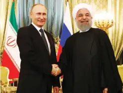  ?? — AFP ?? MOSCOW: Russian President Vladimir Putin meets his Iranian counterpar­t Hassan Rouhani at the Kremlin yesterday.