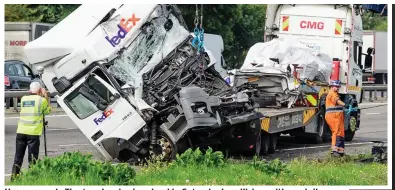  ??  ?? Horror crash: The two lorries involved in Saturday’s collision with a minibus