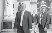  ?? | J. SCOTT APPLEWHITE/AP ?? Speaker John Boehner walks to the chamber Saturday as the House worked into Sunday morning.