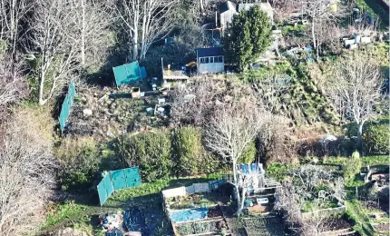  ?? ?? Grim scene: Allotments area in Brighton where the baby’s body was discovered close to a footpath