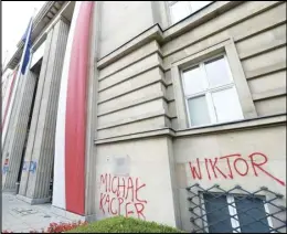  ?? ASSOCIATED PRESS ?? The names of young LGBT people who have died from suicide are shown spray painted on the Education Ministry building, an act of protest by LGBT activists, in Warsaw, Poland, Wednesday.