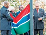  ??  ?? In the fold: Gambia’s flag is raised during a ceremony in London