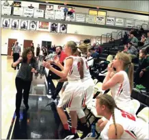  ?? LARRY GREESON / For the Calhoun Times ?? Sonoravill­e coach Stephanie Caudell (left) and the bench celebrates as the final buzzer sounds on Wednesday.