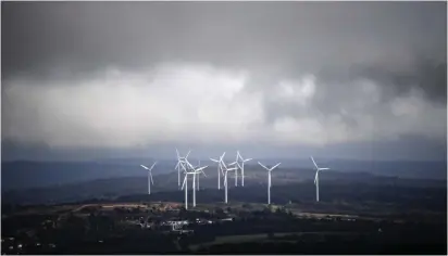  ?? (LOIC VENANCE/AFP/Getty Images/TNS) ?? A PICTURE taken on March 6, 2018 from Plomodiern, western France, shows an electric windmill farm.