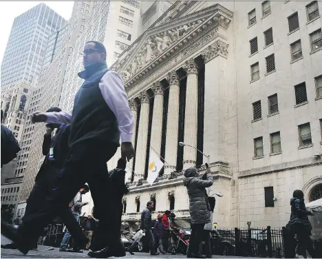  ?? SPENCER PLATT/GETTY IMAGES ?? The U.S. S&amp;P 500 financial sector posted its biggest daily plunge in about nine months due to what analysts say is reduced confidence that U.S. President Donald Trump’s pro-growth policies would occur soon, and concerns about a dovish Federal Reserve.