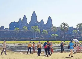  ??  ?? Angkor Wat draws close to three million visitors a year.