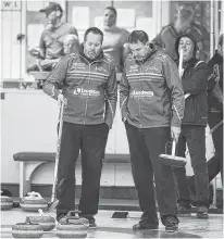  ?? ERIC WYNNE • CHRONICLE HERALD ?? Skip Jamie Murphy, left, and third Paul Flemming talk strategy during action at the 2020 Nova Scotia Men’s Provincial Championsh­ips at the Dartmouth Curling Club on Jan. 20, 2020.