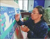  ?? PHOTOS PROVIDED TO CHINA DAILY ?? Wu Shurui paints a design at a studio in Shanxi province.