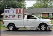  ?? Olivia Morley ?? Friends Alan and Roxanne Brinson lead the surprise parade for Martha Lee Rogers’ 100th birthday Wednesday in Garden Lakes.