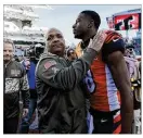  ??  ?? Cleveland Browns head coach Hue Jackson (left) meets with Cincinnati Bengals wide receiver A.J. Green after Sunday’s game in Cincinnati.