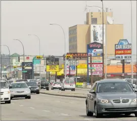  ?? Leah Hennel, Calgary Herald ?? Business owners on Macleod Trail would like to see the route spruced up for pedestrian­s to make shopping along the major route through Calgary more inviting.