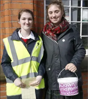  ??  ?? Coláiste Bríde students, Jemma Mallon and Megan Asple, collecting for Down Syndrome Wexfordas the Tour visited Enniscorth­y.