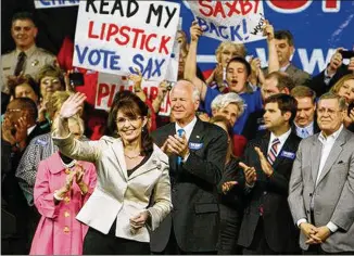  ?? AJC STAFF 2008 ?? Republican vice presidenti­al candidate Sarah Palin campaigns in December 2008 for incumbent Republican­U. S. Sen. Saxby Chambliss ( center) in front of a crowd of about 6,000 atGwinnett Arena in Duluth. Her runningmat­e, the late JohnMcCain, also cameto Georgia for Chambliss.