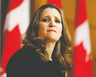  ??  ?? Finance Minister Chrystia Freeland speaks to news media before unveiling her first fiscal update, the Fall Economic
Statement 2020, in Ottawa on Monday. Freeland's statement anticipate­s a $381-billion federal deficit in 2021.