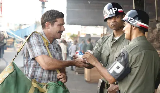  ?? APPLE TV+ ?? Chickie (Zac Efron) travels from Manhattan to Vietnam in 1967 to deliver Pabst Blue Ribbon to his buddies in “The Greatest Beer Run Ever.”