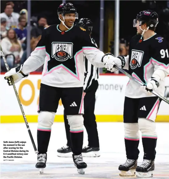  ?? GETTY IMAGES ?? Seth Jones (left) enjoys his moment in the sun after scoring for the Central Division during its 6-4 semifinal victory over the Pacific Division.