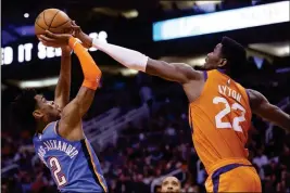  ?? ASSOCIATED PRESS ?? PHOENIX SUNS CENTER DEANDRE AYTON (22) blocks the shot of Oklahoma City Thunder guard Shai Gilgeous-Alexander (2) during Friday’s game in Phoenix.