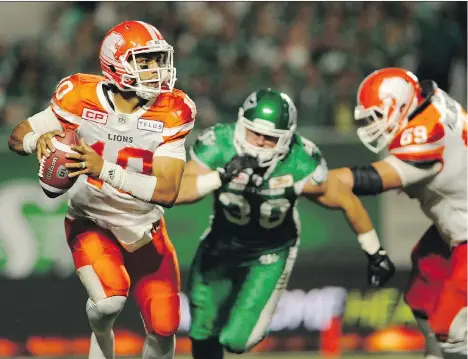  ?? MARK TAYLOR/THE CANADIAN PRESS ?? B.C. Lions quarterbac­k Jonathon Jennings is pressured by Saskatchew­an linebacker Cameron Ontko on Sunday night in Regina. Returning from injury, Jennings had a dismal performanc­e that included throwing four intercepti­ons in the team’s 41-8 loss.