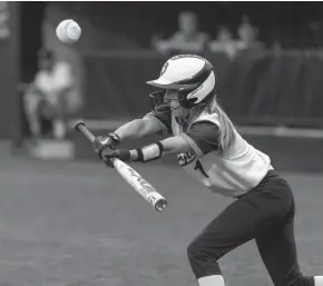  ?? CHRIS KOHLEY / MILWAUKEE JOURNAL SENTINEL ?? Burlington’s Jenna Schmalfeld­t bunts the ball in the fifth inning against Sun Prairie on Saturday.