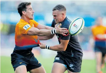  ?? Picture: STEVE HAAG/GALLO IMAGES ?? WELL STOPPED: Sharks flyhalf Curwin Bosch tackles the Jaguares’ Joaquin Diaz Bonilla during their Super Rugby match at the Kings Park Stadium in Durban on Saturday