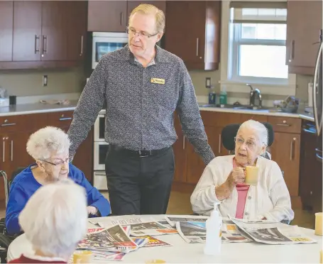  ?? LIAM RICHARDS ?? Randy Kurtz, CEO of Sunnyside Adventist Care Centre, speaks with residents of the Saskatoon care centre in February 2020, before the pandemic was declared. While some residents are anticipati­ng a reopening, others have lingering concerns after more than a year in lockdown.