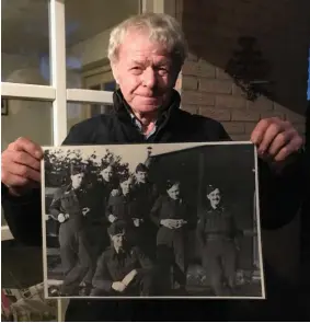  ??  ?? Lower right: Jan Schoofs holds a photo of Canadian bomber crewmen who died after their plane was shot down in 1943 over his family farm near Groesbeek, Netherland­s.