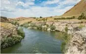  ?? DREAMSTIME ?? The world’s largest mineral hot spring in Thermopoli­s, Wyoming.