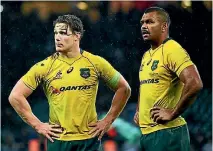  ?? DAN MULLAN/GETTY IMAGES ?? Wallabies stars Michael Hooper and Kurtley Beale were left pretty unimpresse­d by the defeat to England.