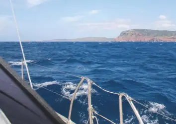  ??  ?? ABOVE Many stretches of the north coast of Menorca are devoid of hotels and houses RIGHT The smart saloon is spacious and comfortabl­e. This is Jo Humphreys relaxing in her family yacht – much tidier than our tired charter boat