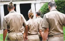  ?? YANA PASKOVA FOR THE WASHINGTON POST ?? Merchant Marine midshipmen walk to class at the U.S. Merchant Marine Academy in Kings Point, N.Y. A review has found the academy’s curriculum is outdated.